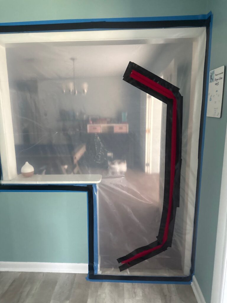A proper plastic containment barrier set up for mold post remediation verification in Tampa Bay, FL.